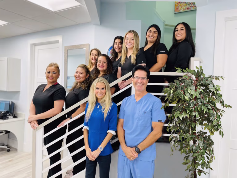 Cameron-Dental-Studio-staff-image-stairs-2-768×576 Dr. Cameron and Dr. Djindil together with their staff