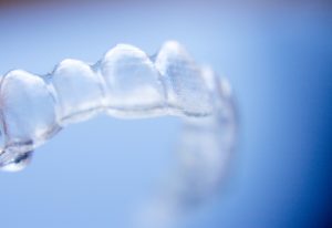 Close-up photo of an Invisalign or ClearCorrect aligner.