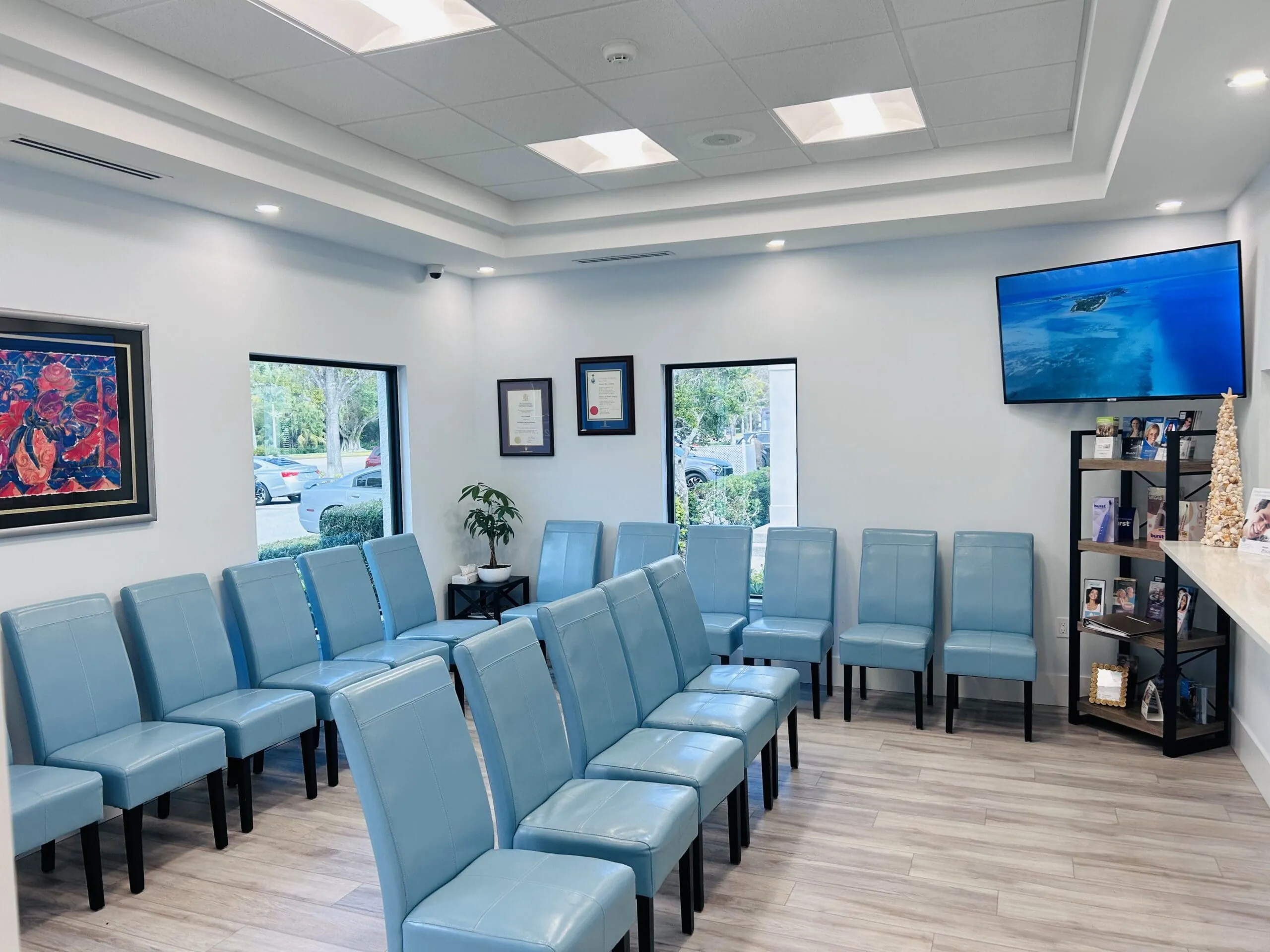 Different angle of the same waiting room and front area of Cameron Dental Studio dentist office