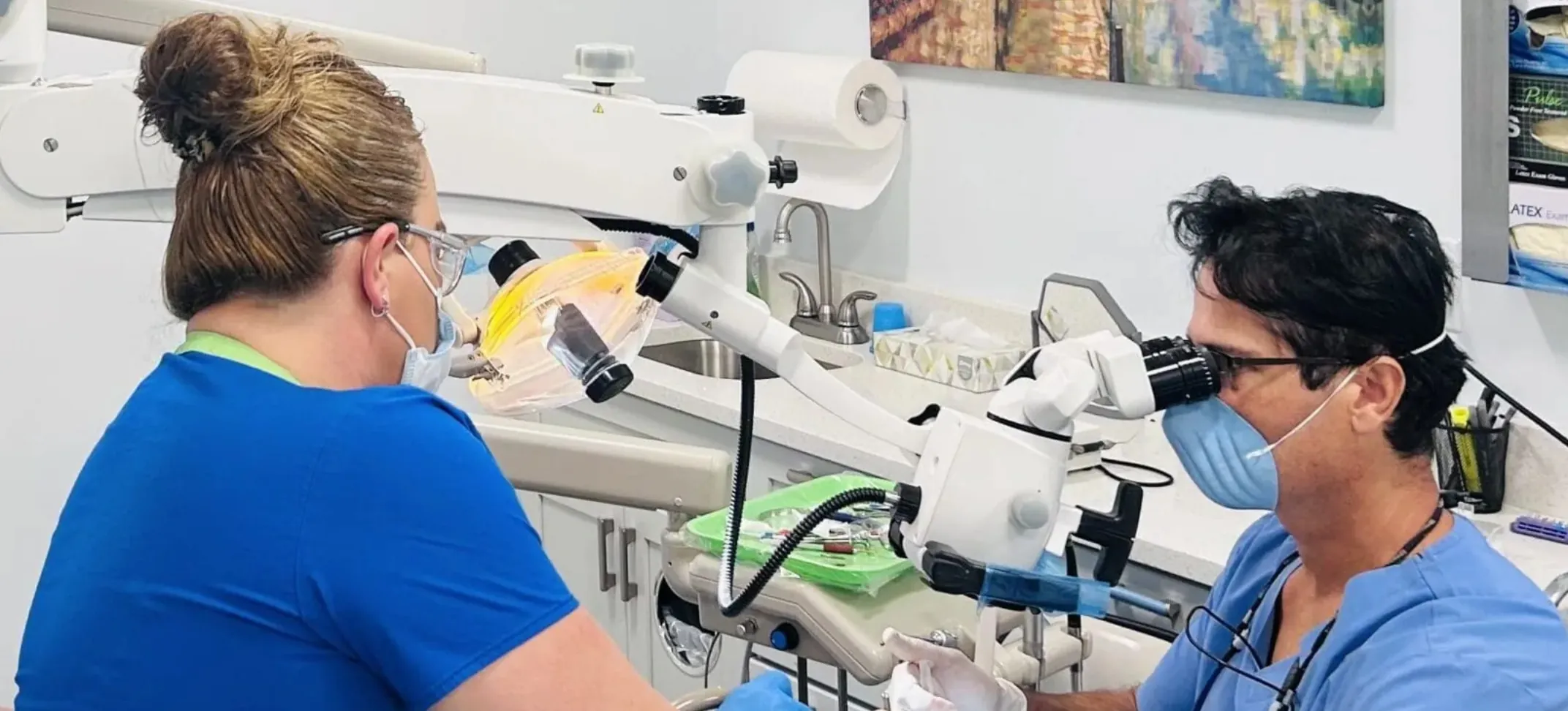 Dr. Djindil with his assistant working on a dental patient.