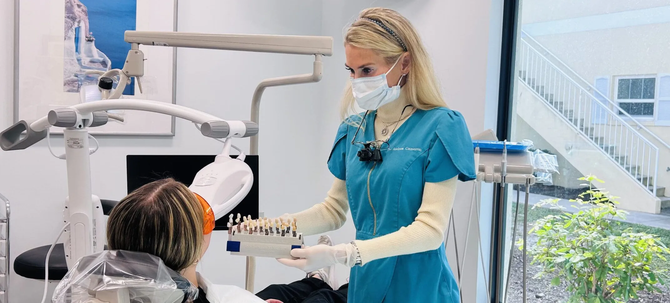 Dr. Cameron showing teeth whitening options to her dental patient.